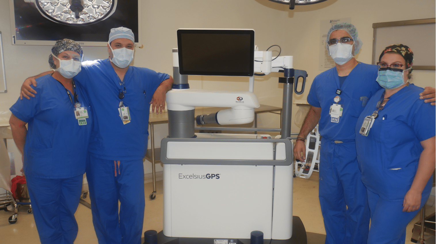 Spinal surgeons in the operating room posing